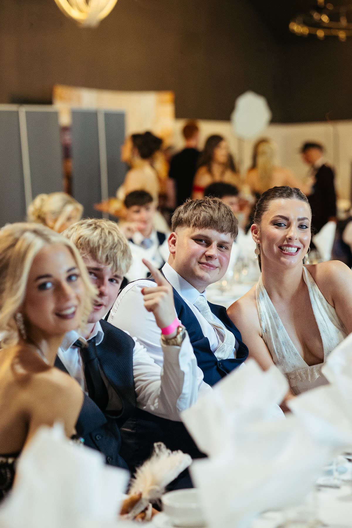 Friends celebrating together at a DebsGuru event