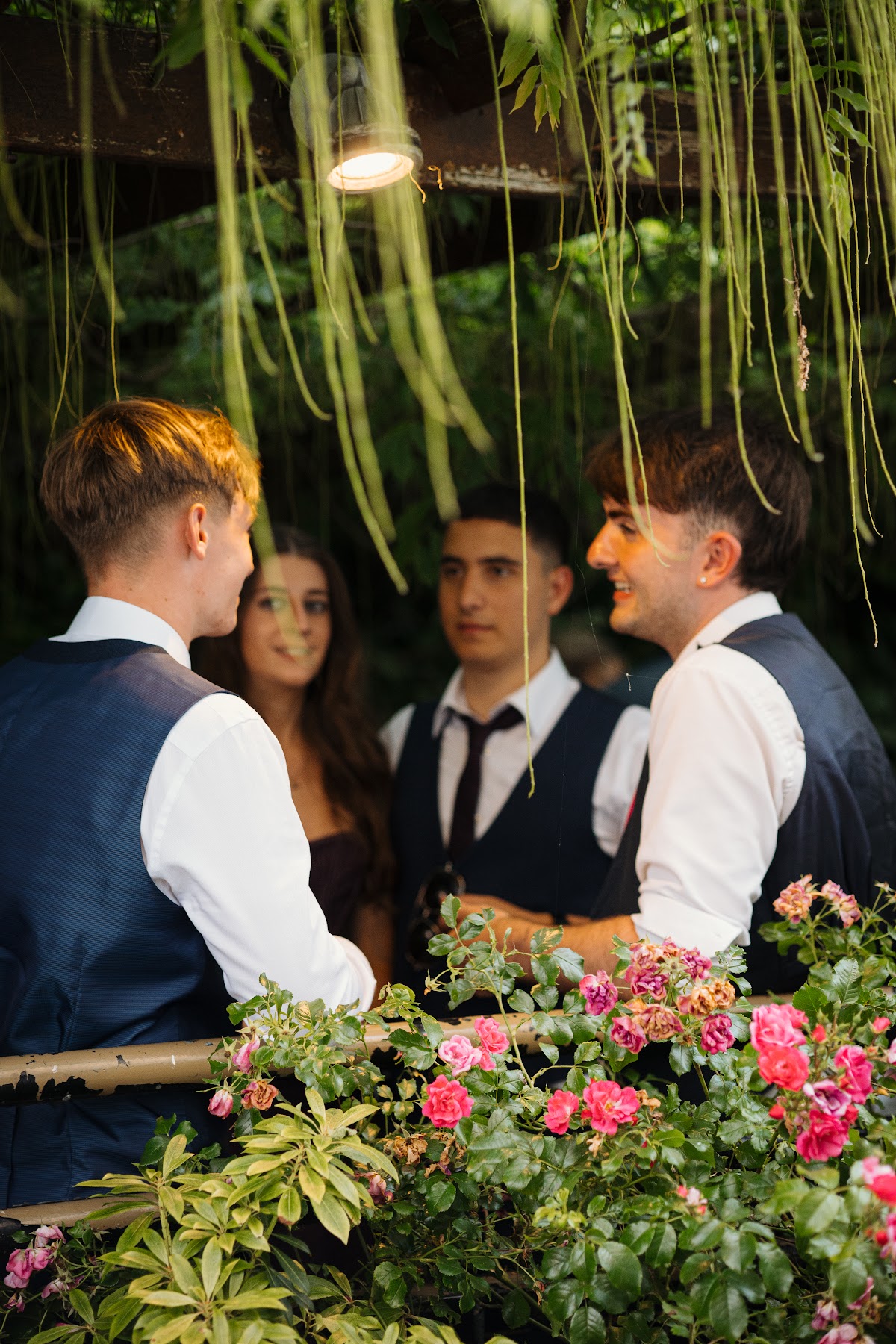 Friends catching up in the garden at their Debs