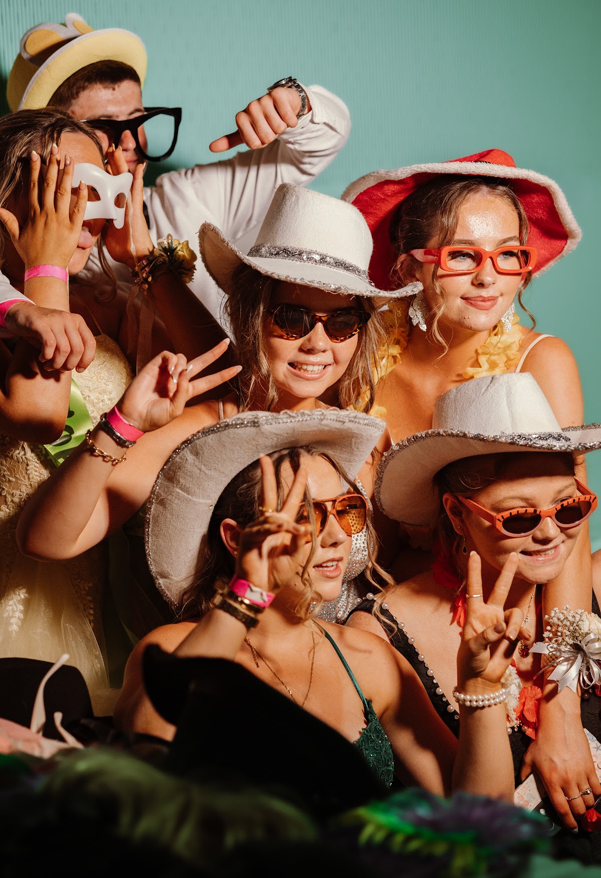 A large group of friends crowding into the photobooth